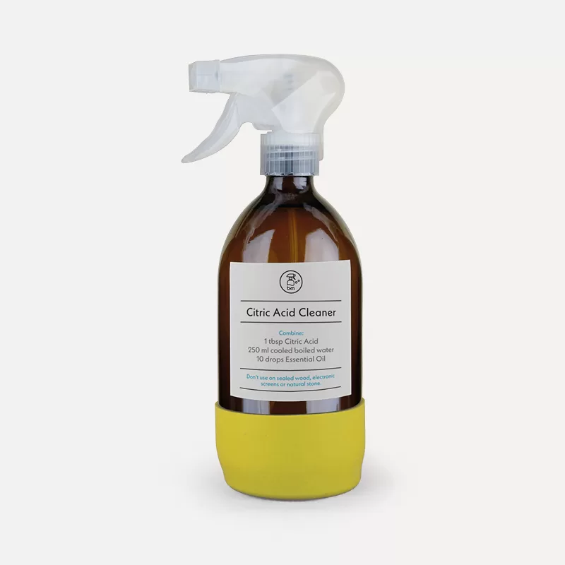 Citric Acid Cleaner in a glass spray bottle with recipe label