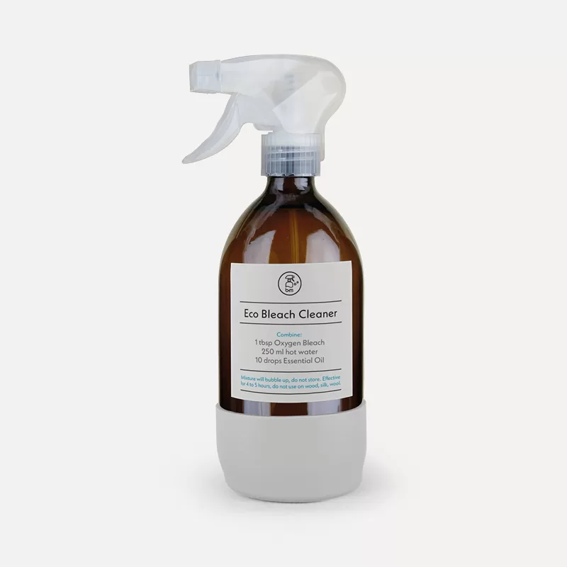 Eco Bleach Cleaner in a glass spray bottle with recipe label