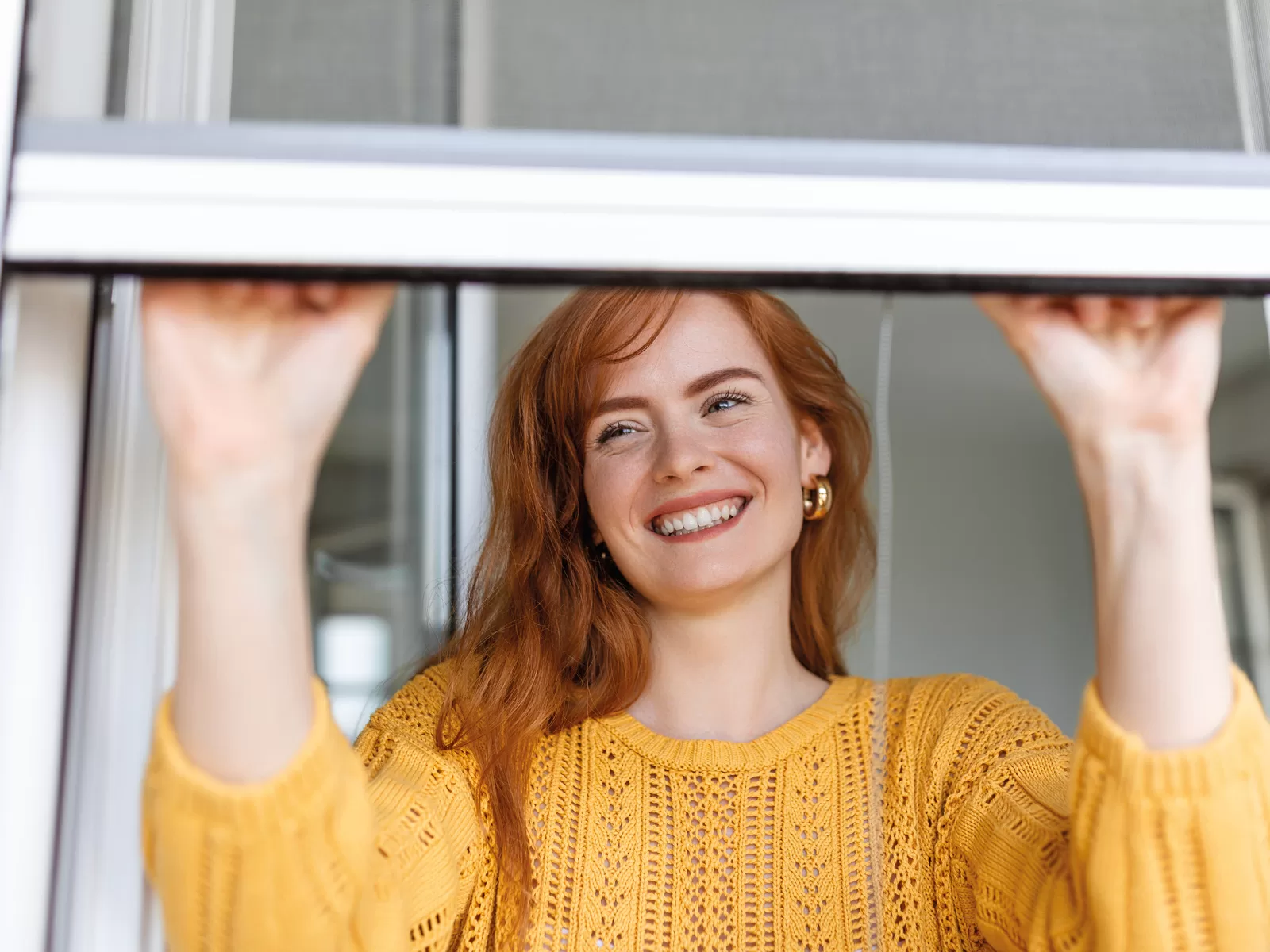 Woman opening window